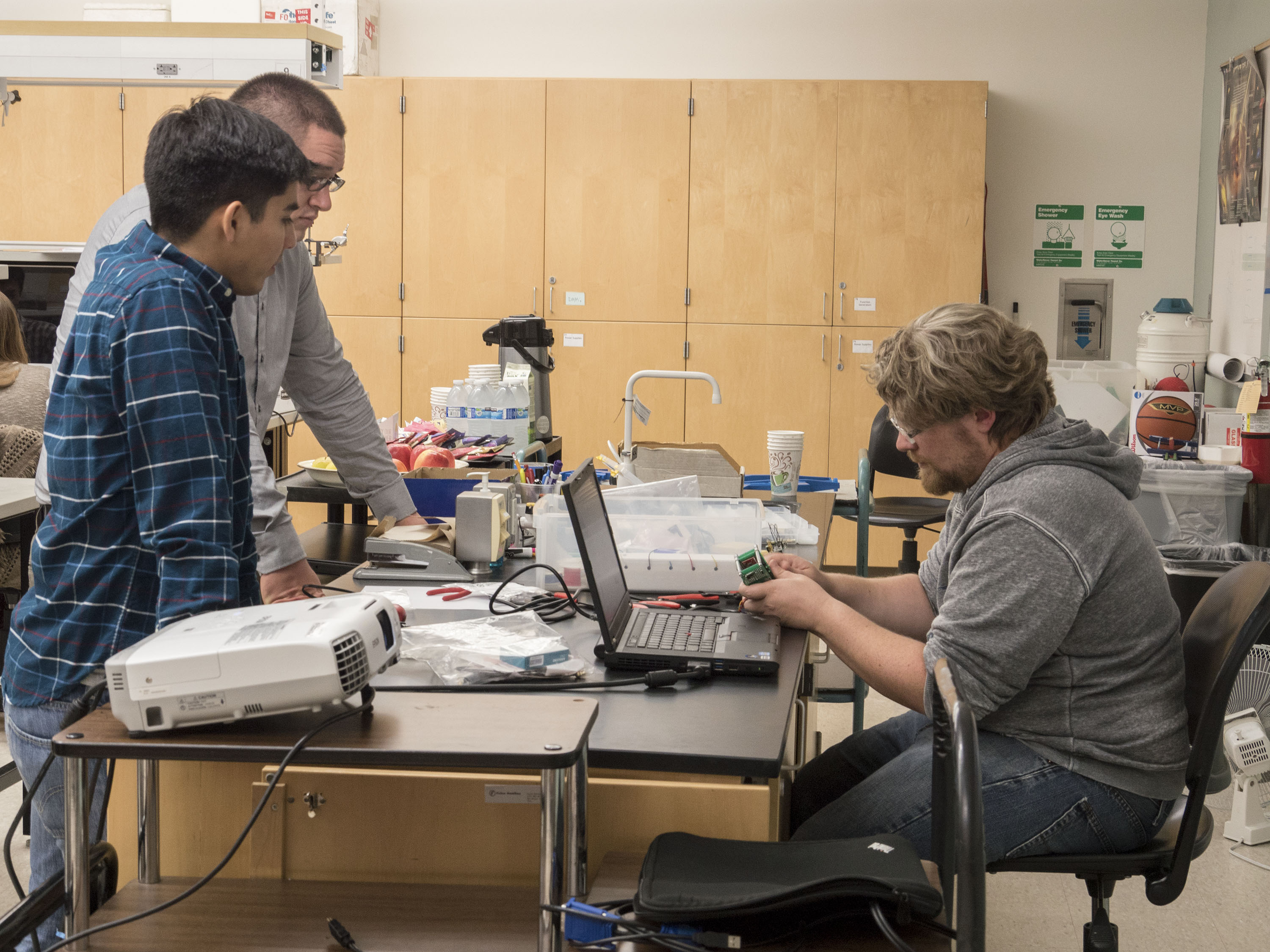 Students working in a lab on drone parts