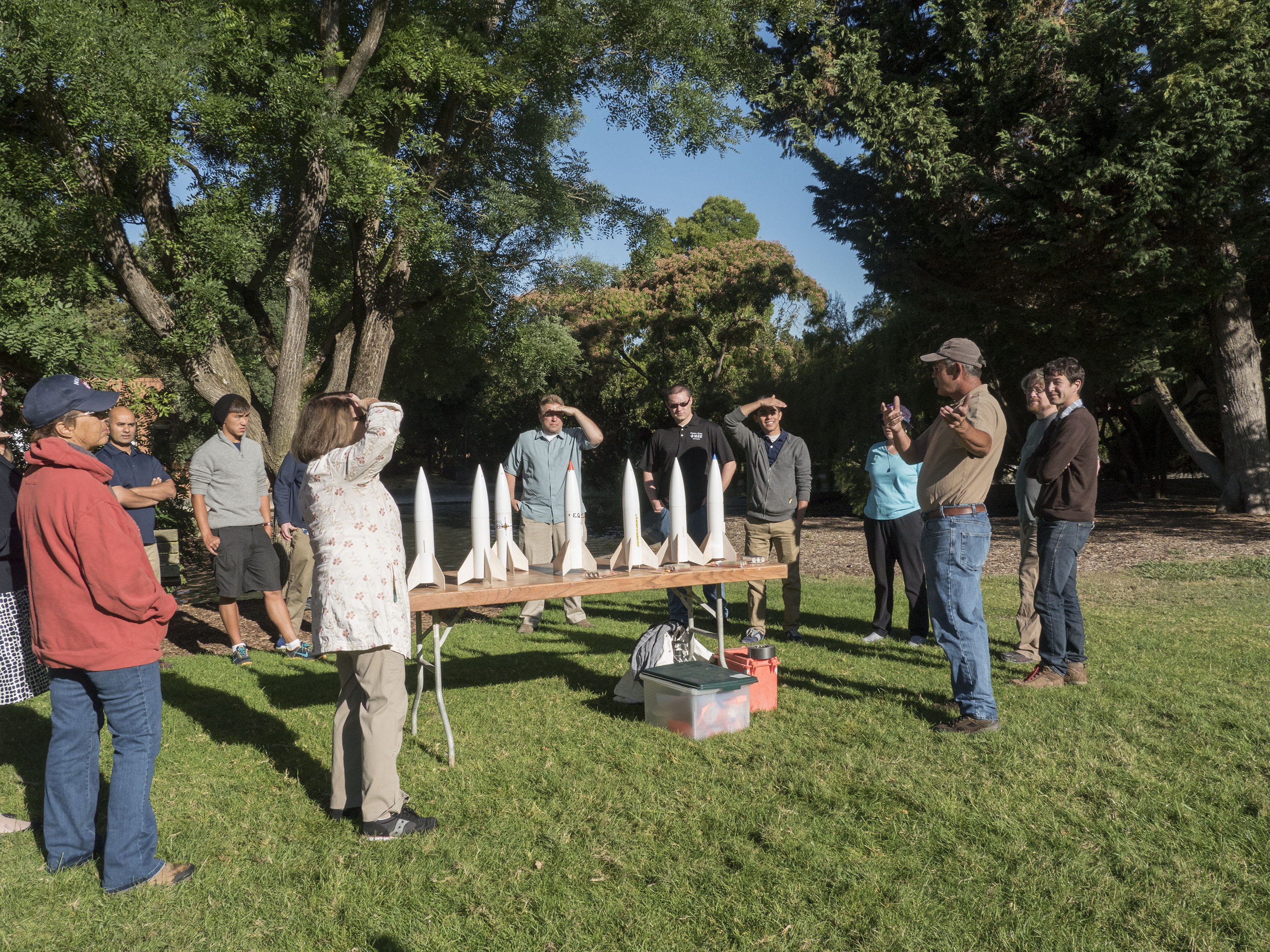 Students preparing for rocket launch outside